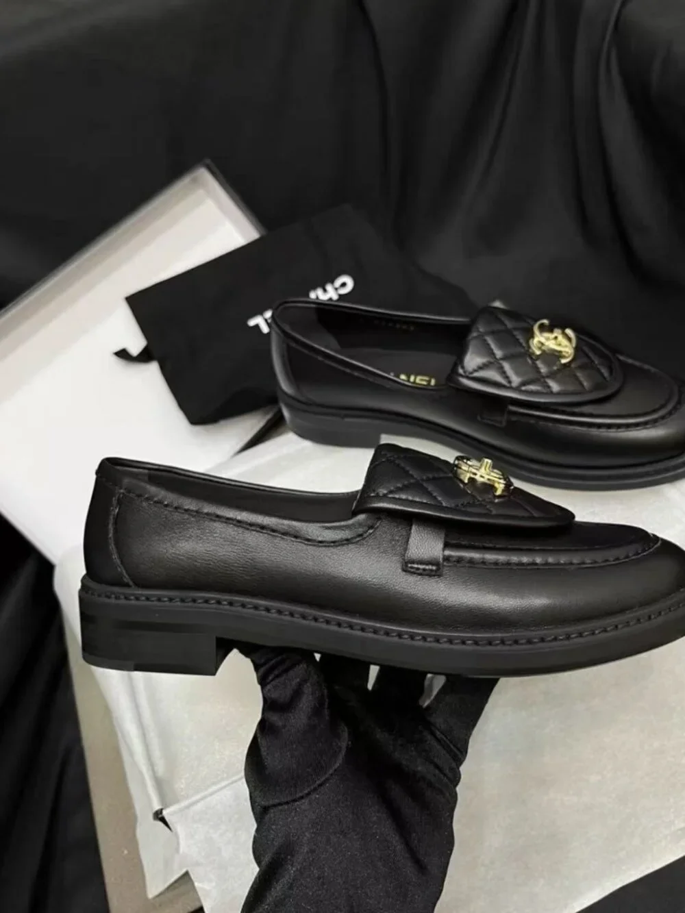 CHANEL black flap‑design loafers